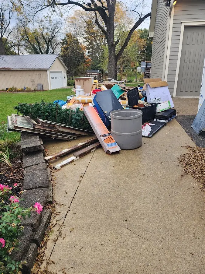 Dumpster being loaded with debris for 3 Yard Dumpster Rental in Cascade Valley